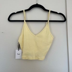 NWT Aritzia TNA yellow crop top 
Never worn 
Size XS